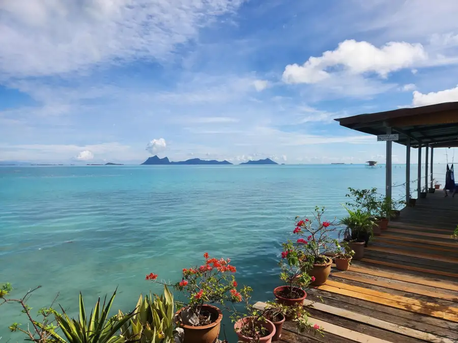 Scenic view from the wooden boardwalk between bungalows Bigfin Water Bungalow